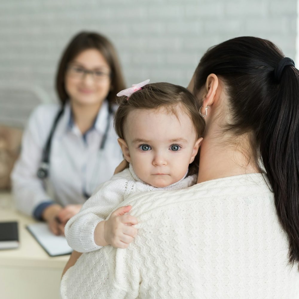 Portrait of mother and child at a doctor's appointment.